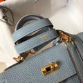 Elegant Bluish-Gray Hermès Kelly-Style Handbag with Gold Hardware Chic Tread